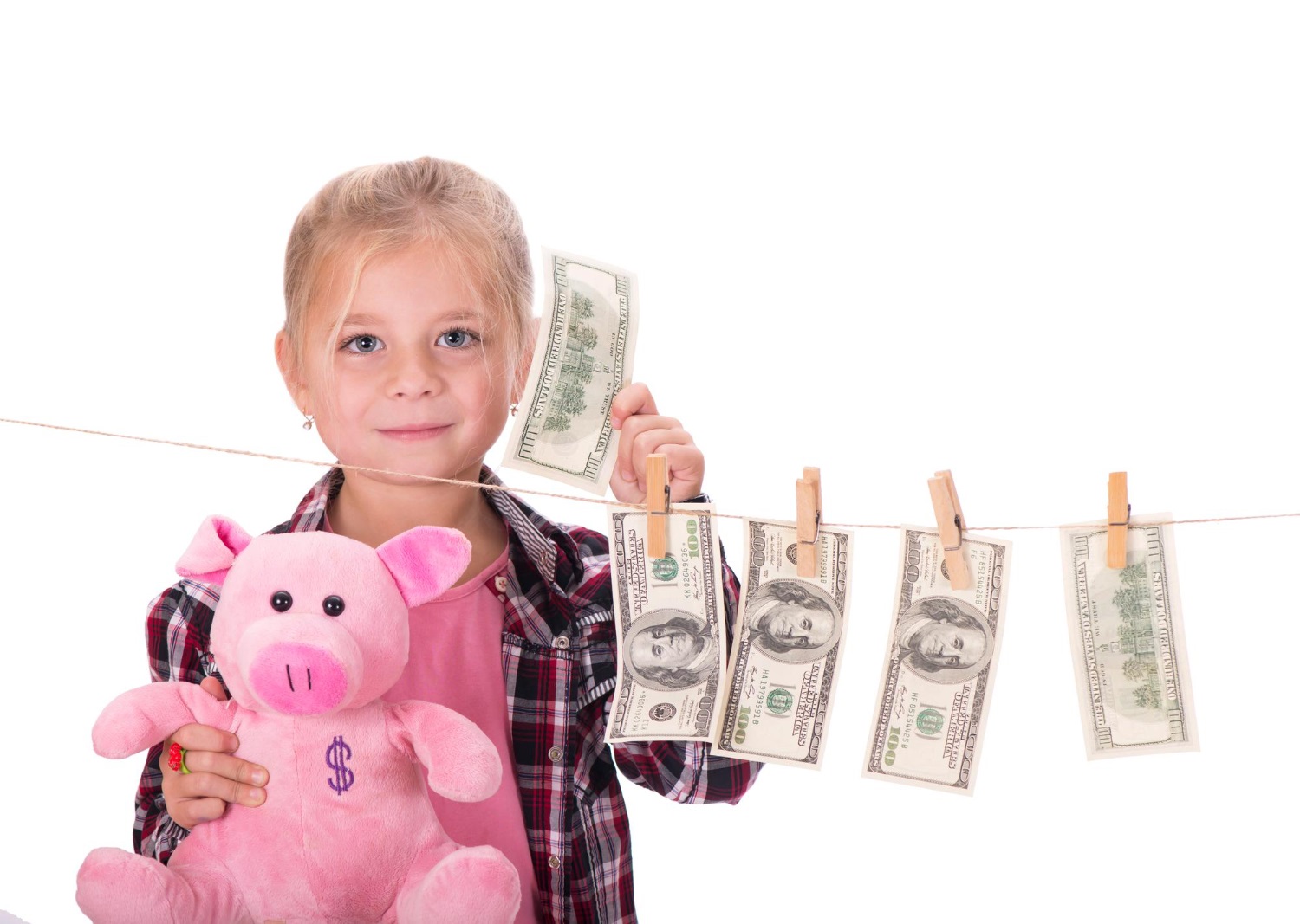 Dziewczynka trzyma pieniądze z zasiłku w Norwegii